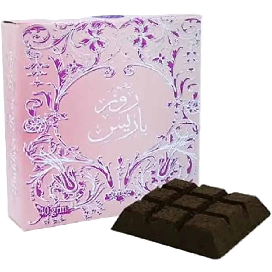 Dark brown cube-shaped bukhoor rose paris incense blocks in a decorative floral box by ard al zaafaran