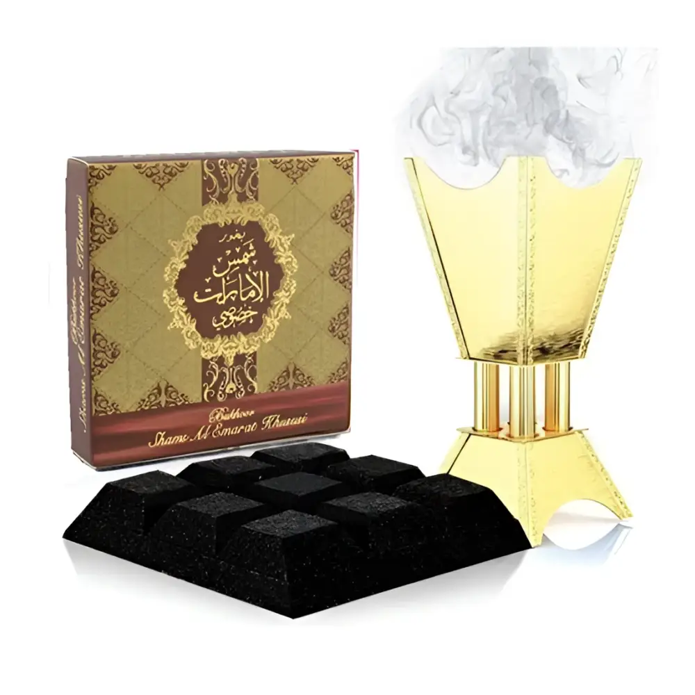 Golden geometric incense burner with smoke rising for bukhoor shams al emarat by ard al zaafaran 40g