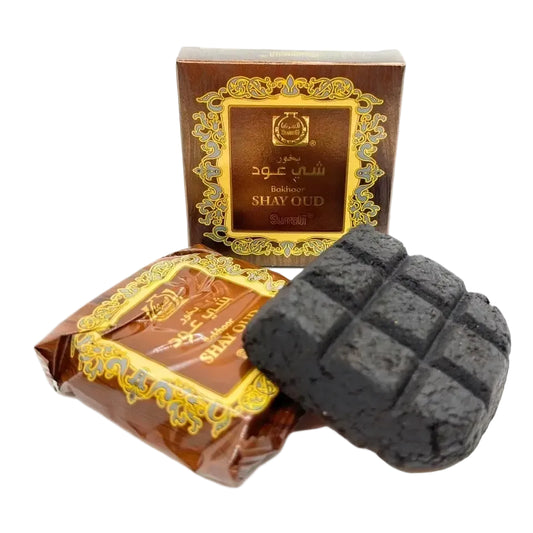 Black grid-patterned aromatic coal bukhoor shay oud in brown and gold sumadi box for bukhoor shay use