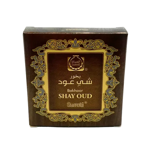 Dark brown rectangular box with gold and silver ornate border design featuring surrati bukhoor shay oud bakhour 40g