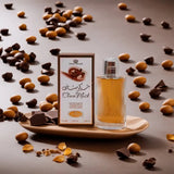 Perfume bottle and packaging on a plate with chocolate and nuts around