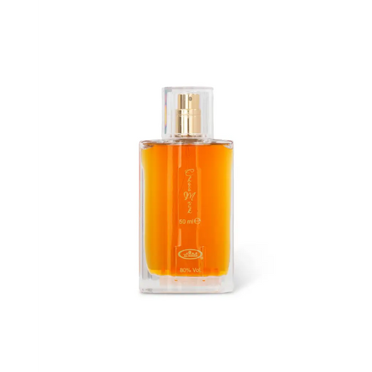 Perfume bottle with orange liquid on a white background