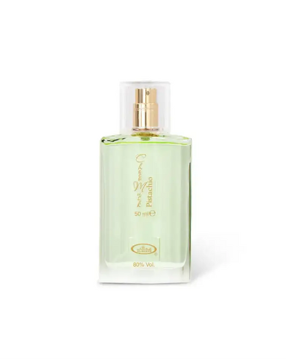 A clear glass bottle of choco musk pistachio edp 50ml with gold nozzle and green pistachio scent by al rehab