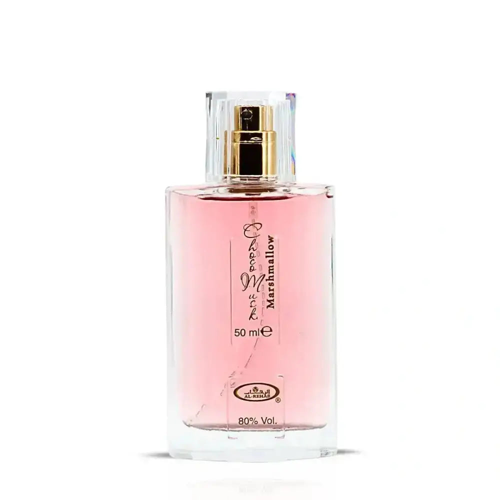 A clear glass bottle with gold-tone spray nozzle filled with pink choco musk marshmallow perfume by al rehab 50ml edp