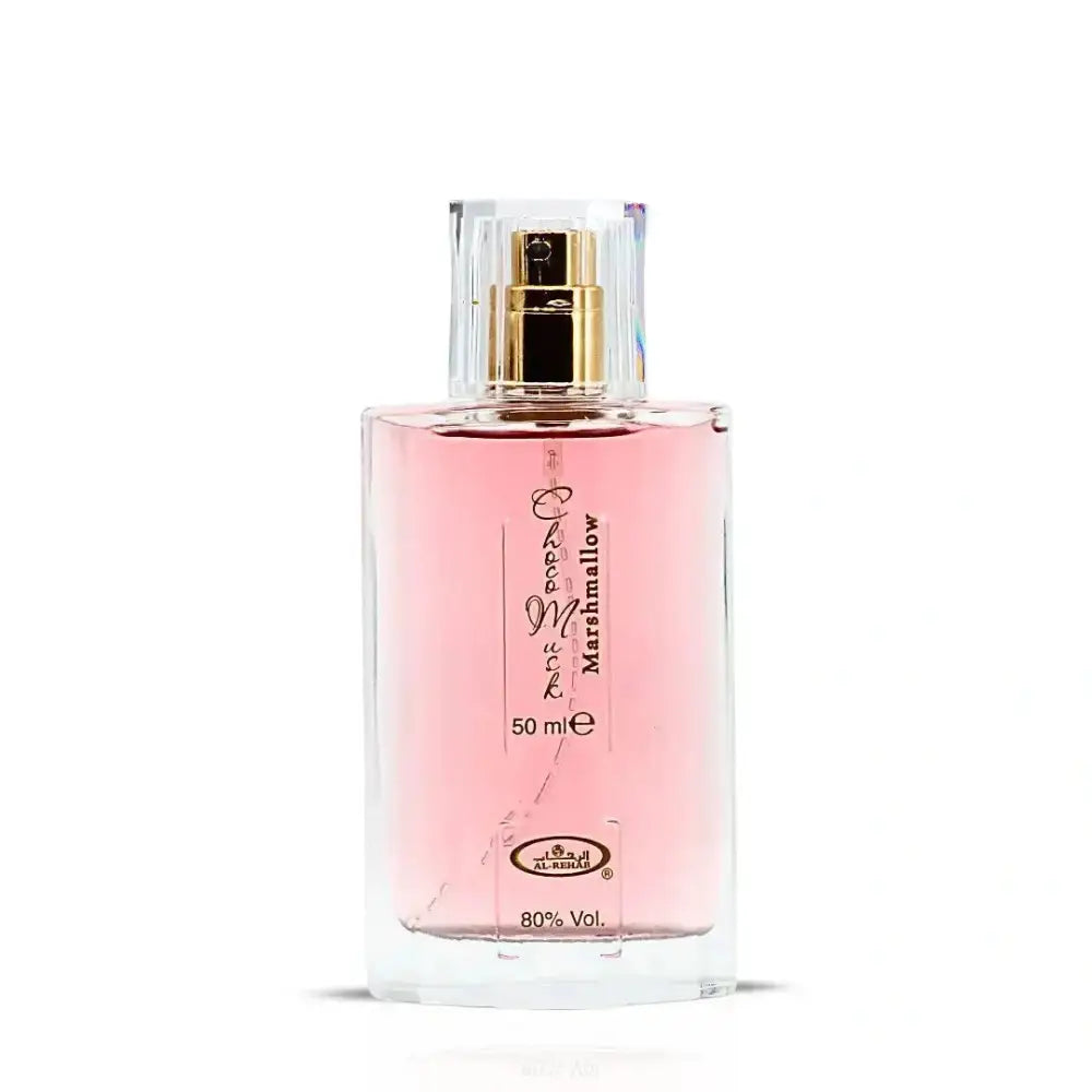 A clear glass bottle with gold-tone spray nozzle filled with pink choco musk marshmallow perfume by al rehab 50ml edp