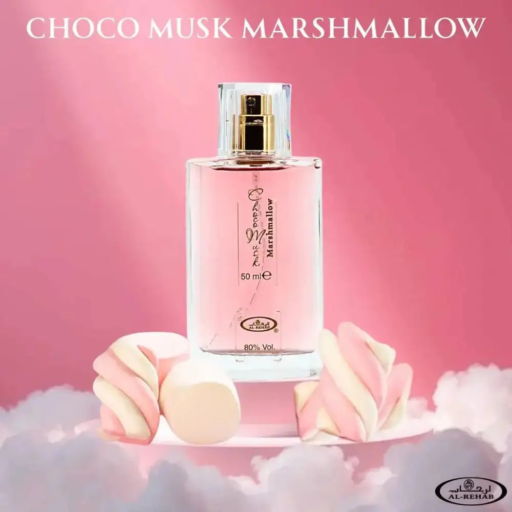A clear glass perfume bottle with gold-tone nozzle filled with pink choco musk marshmallow eau de parfum by al rehab