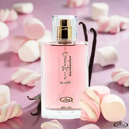 A clear glass bottle of choco musk marshmallow edp 50ml by al rehab with pink liquid and gold spray nozzle surrounded by marshmallows