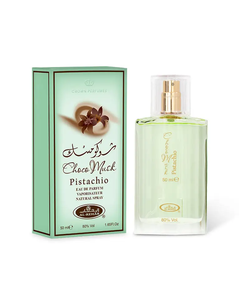 A clear glass bottle of crown perfumes choco musk pistachio eau de parfum with gold spray nozzle and mint green box