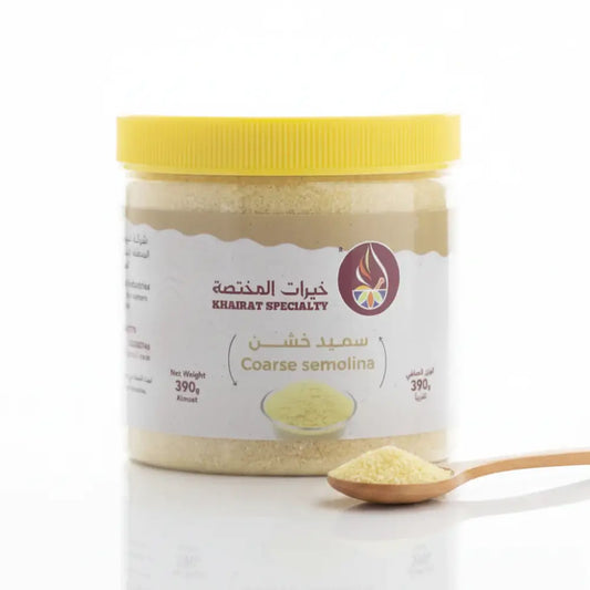 Jar of coarse semolina with a yellow lid on a white background