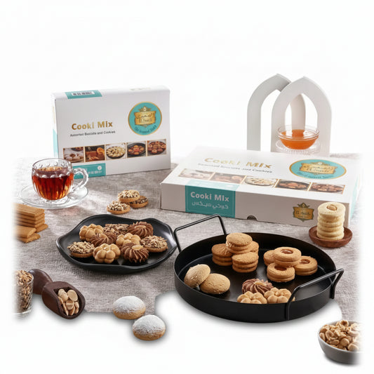 Assorted golden-brown and chocolate middle eastern cookies displayed on black trays from el saidy cookie mix 1900g