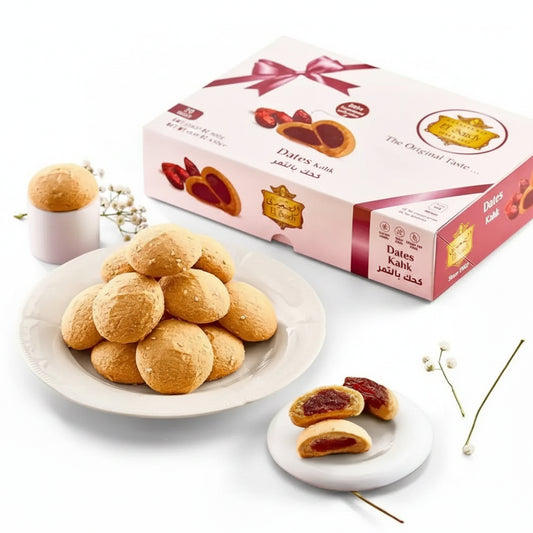 A white plate with golden-brown round authentic egyptian cookies filled with dates 500g kahk by el saidy