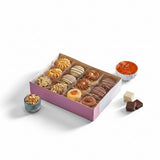 A purple gift box of el saiedy egyptian cookies featuring assorted petit four with chocolate-striped and jam-filled pastries