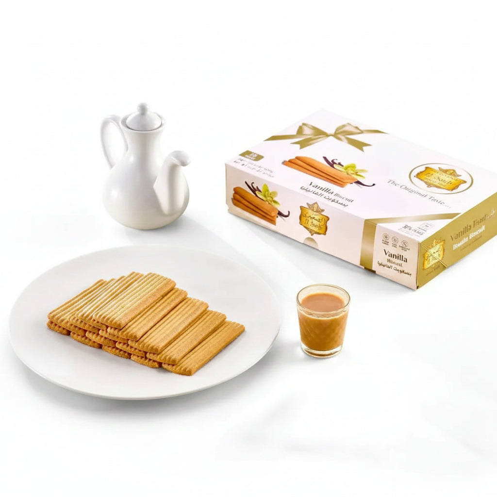 Golden-brown vanilla biscuits neatly arranged on a white plate with elegant gold and white el saidy packaging labeled the original taste