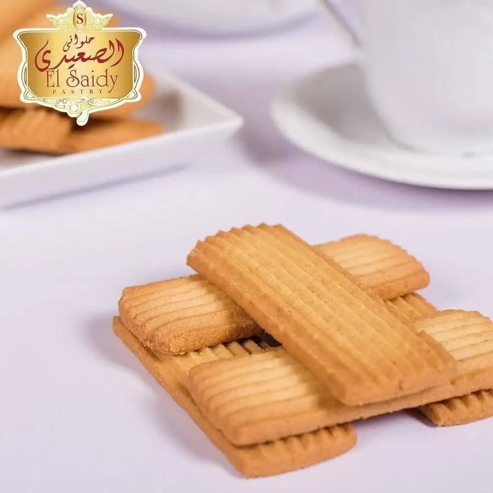 Golden brown ridged rectangular vanilla biscuits from el saidy pastry in a 420g package of egyptian cookies