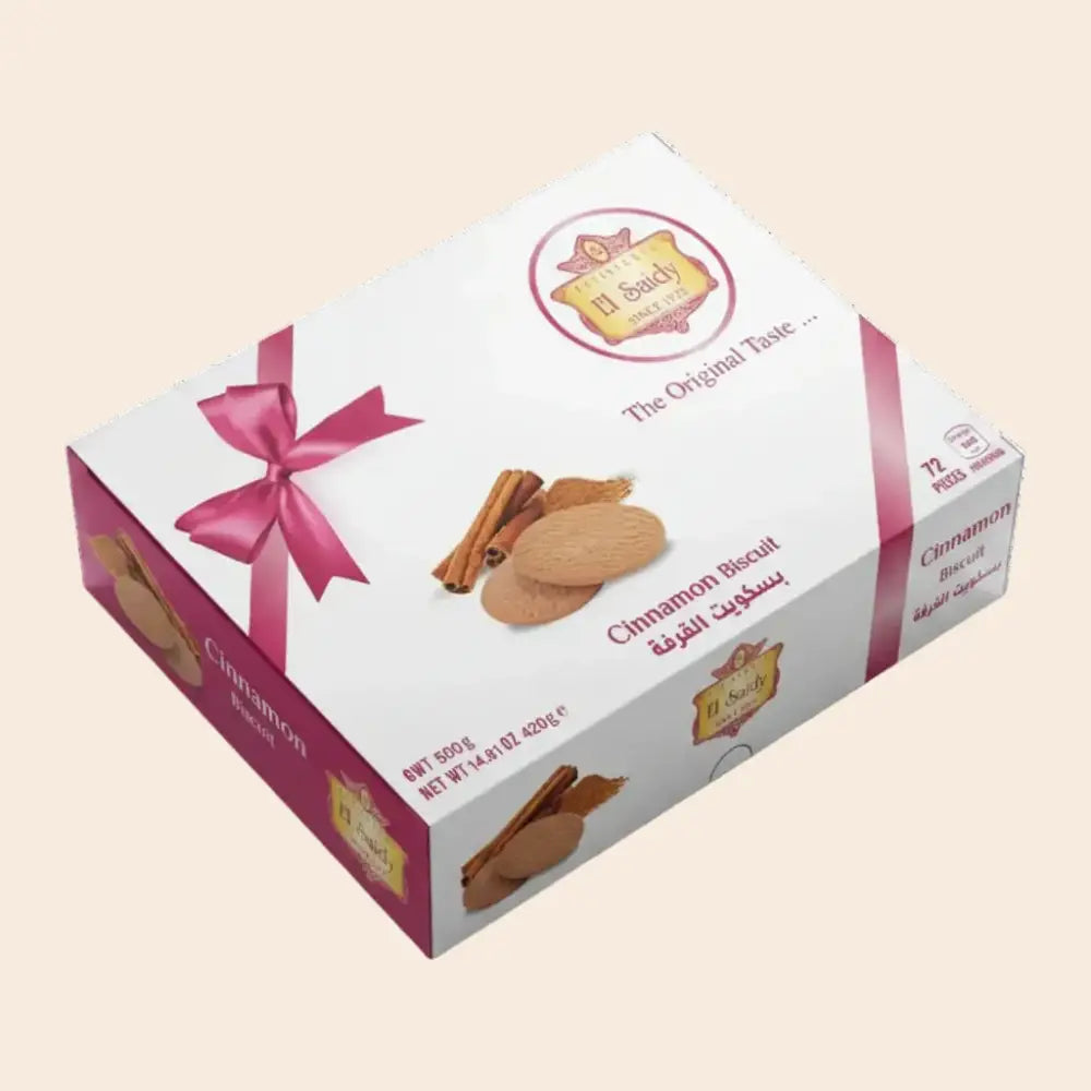 Cinnamon biscuit box with pink ribbon and branding on a white background