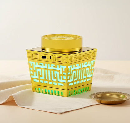 Golden electric quran speaker with intricate greek key pattern and glowing turquoise led lights for quran recitation