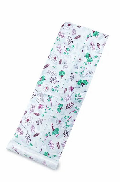 White disposable table sheets sufra roll with green pink and purple floral pattern for food serving and dining area lining