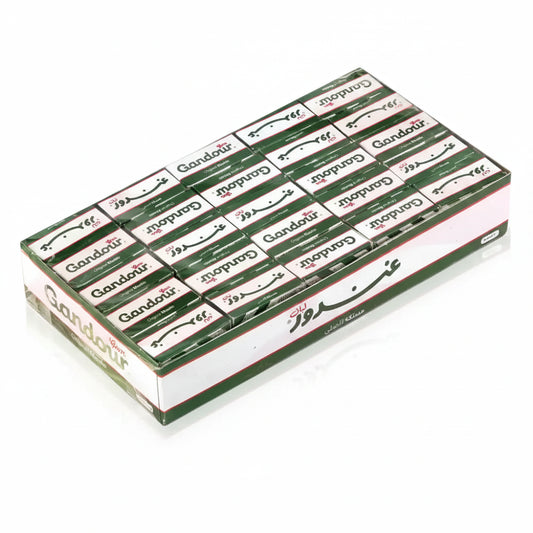 A bulk box of Gandoür incense sticks, showing multiple individual packs arranged inside a larger green and white cardboard container on a plain white background.