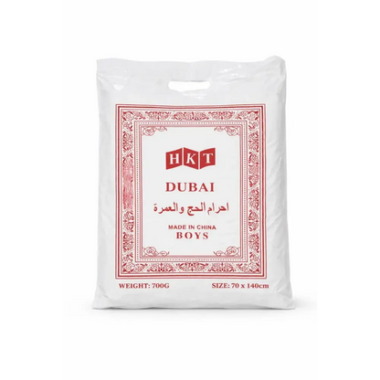 White plastic bag with red ornate border and hkt dubai branding containing boys clothing for umrah complete essentials set with digital tasbih and activity book