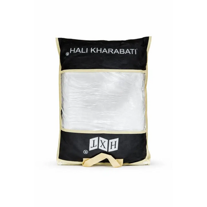 Black and cream fabric umrah complete essentials bag with clear window showing white crinkled ihram cloth and activity book