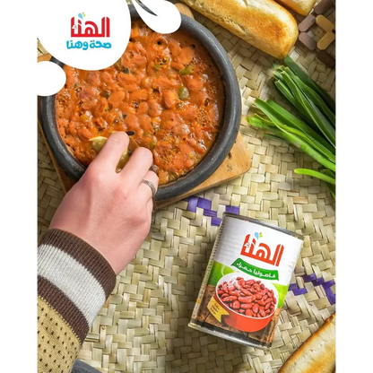 A can of hanaa red kidney beans with arabic label beside a bowl of middle eastern bean stew with rich taste red kidney beans