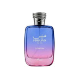 A gradient blue to pink glass perfume bottle with silver cap labeled hawas for him london 100ml eau by noor east