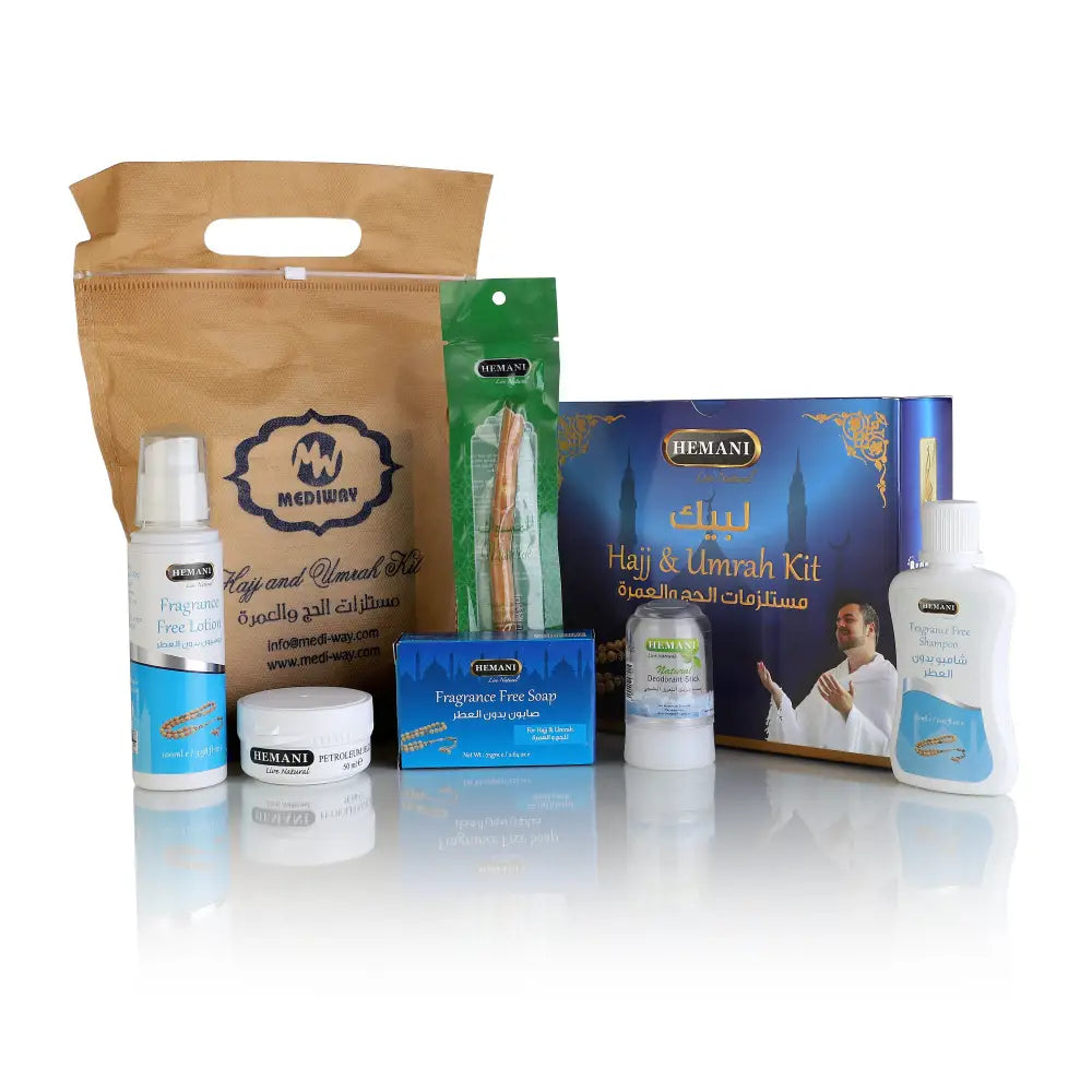 Collection of travel-sized products including bottles, a box, and a bag on a white background
