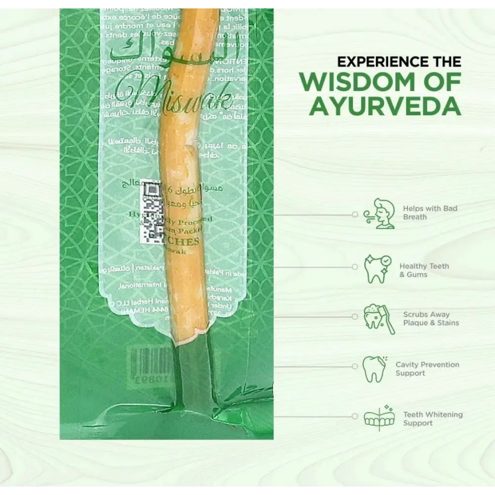 Traditional wooden toothbrush with packaging on a green background, promoting Ayurveda.