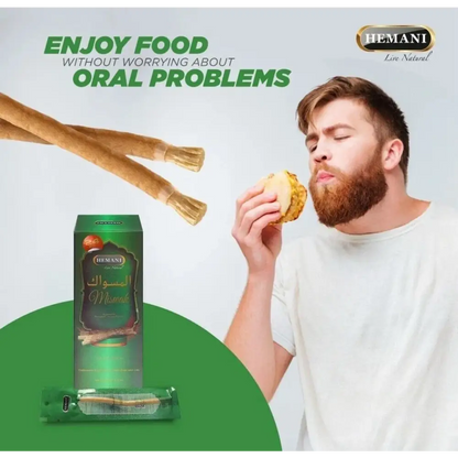 Man eating a snack with Hemani product packaging and branding in the background