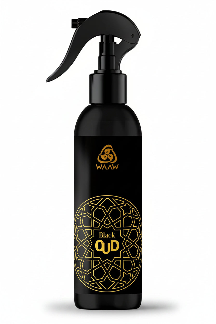 A black trigger spray bottle with gold lettering and a geometric pattern, labeled 'WAAW Black QUD'.
