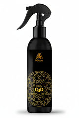A black trigger spray bottle with gold lettering and a geometric pattern, labeled 'WAAW Black QUD'.