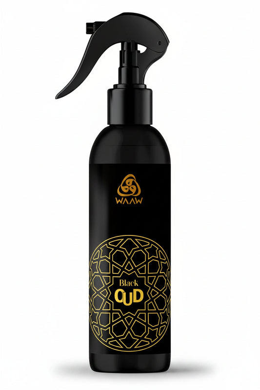 A black trigger spray bottle with gold lettering and a geometric pattern, labeled 'WAAW Black QUD'.