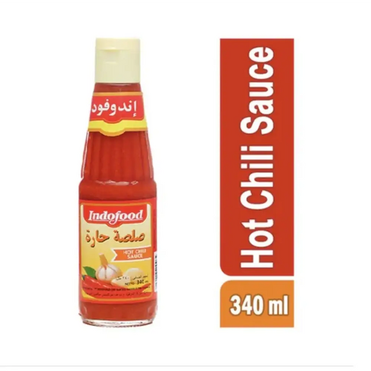 Indofood hot chili sauce 340ml in a clear glass bottle with yellow cap and label featuring garlic and chili imagery