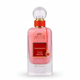 A pink glass perfume bottle of ithra dubai musk pomegranate eau de parfum 100ml with gold cap and red ribbon tie