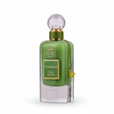 A sleek emerald green glass perfume bottle with gold accents labeled ithra dubai musk pistachio eau de parfum 100ml