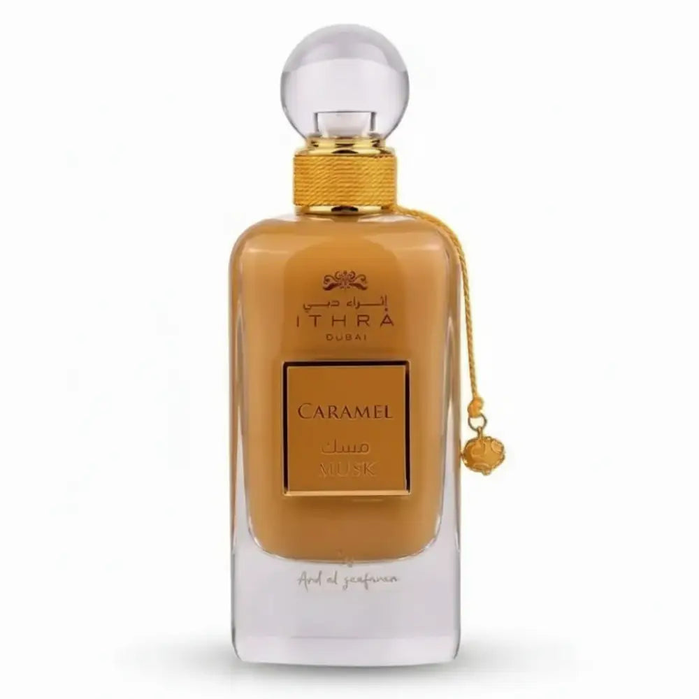 Luxurious amber ithra dubai musk caramel eau de parfum bottle with gold cap and chain tassel 100ml ard al zaafaran