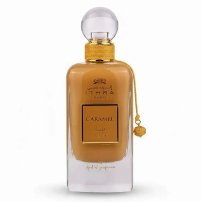 Luxurious amber ithra dubai musk caramel eau de parfum bottle with gold cap and chain tassel 100ml ard al zaafaran