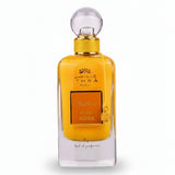 Golden-hued ithra dubai musk mango eau de parfum 100ml with clear glass body and ornate mango and musk label