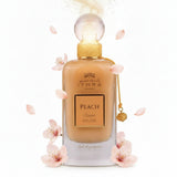 A sleek transparent glass perfume bottle with golden cap containing amber ithra dubai musk peach fragrance
