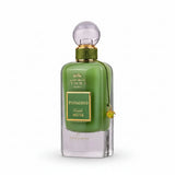 A sleek emerald green glass perfume bottle with gold accents labeled ithra dubai musk pistachio eau de parfum 100ml