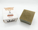 Bar of soap with decorative packaging on a white background