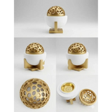 Luxury bakhoor incense burner with gold perforated spherical ceramic oud holder and white ceramic base with gold stand