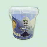 A blue plastic bucket with handle and clear lid containing moroccan blue nila powder 30g for glow and radiance