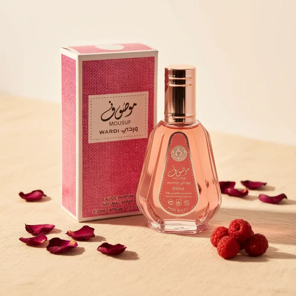 Pink perfume bottle and packaging with 'Mousuf Wardi' branding on a white background