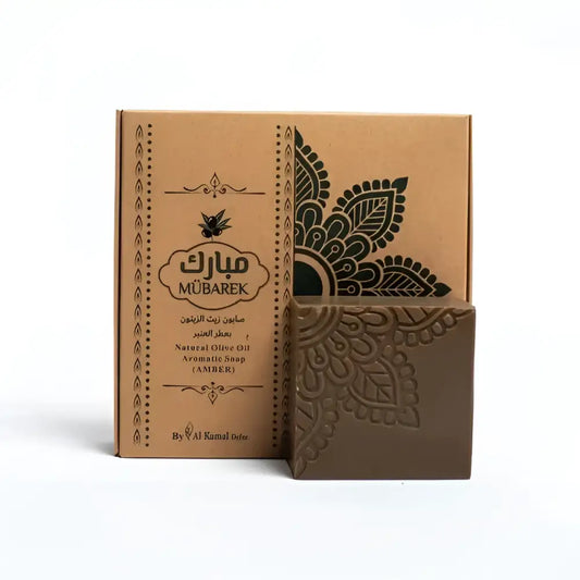 Brown intricately embossed amber-scented mübarek natural olive oil soap in kraft paper box with black floral designs
