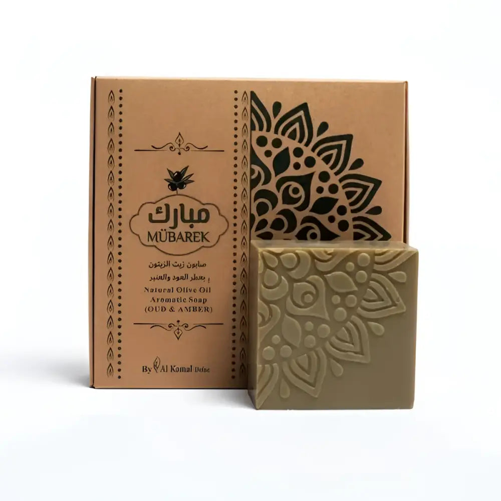 Mübarek natural olive oil aromatic soap oud and amber rectangular olive green bar with embossed mandala design next to packaging
