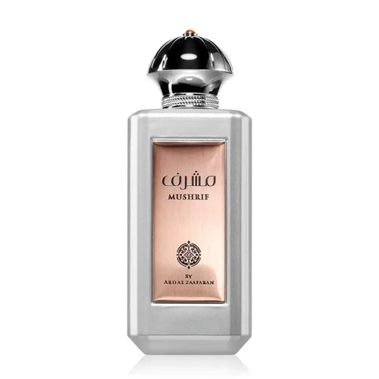 Silver rectangular perfume bottle with rose gold label and chrome dome cap of ard al zaafaran mushrif edp 100ml with blood orange and orange blossom notes