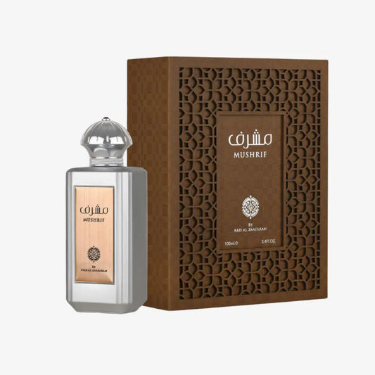 Silver rectangular perfume bottle with faceted glass stopper and gold label featuring arabic script by ard al zaafaran for mushrif edp 100ml with blood orange and orange blossom notes