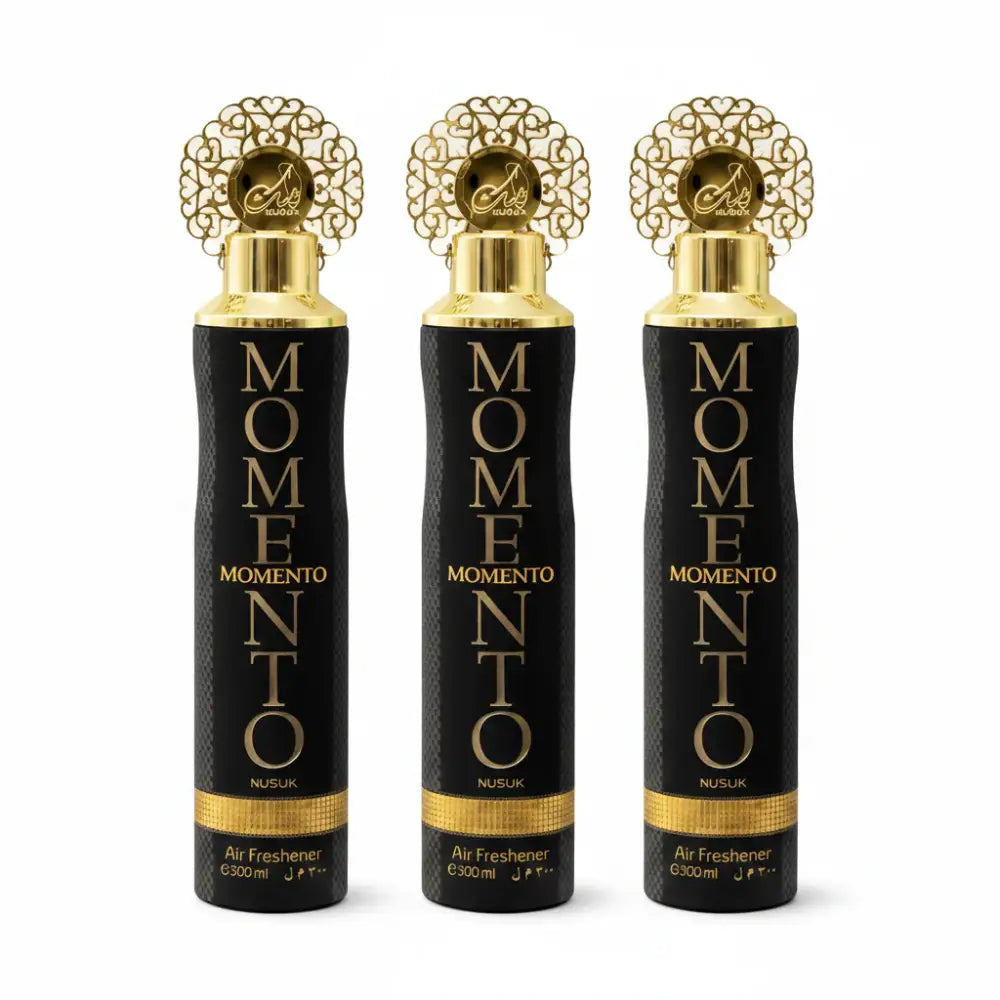 Three Momento air freshener bottles with black and gold design on a white background