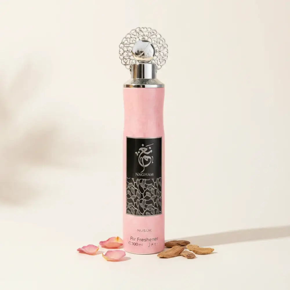 Pink air freshener with silver top on a white background